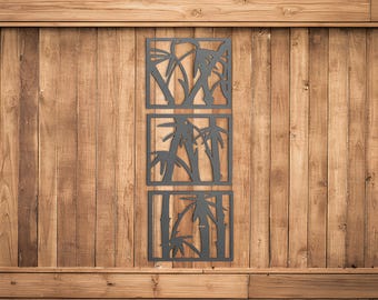 May include: Three black metal wall decor panels with a bamboo design. Each panel is square and features a different arrangement of bamboo stalks and leaves.