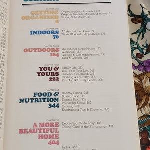 May include: A book titled "Getting Organized" with a table of contents listing chapters on organizing your household, indoors, outdoors, you and yours, food and nutrition, and a more beautiful home. The book cover is a light brown with a peach colored title and chapter headings.
