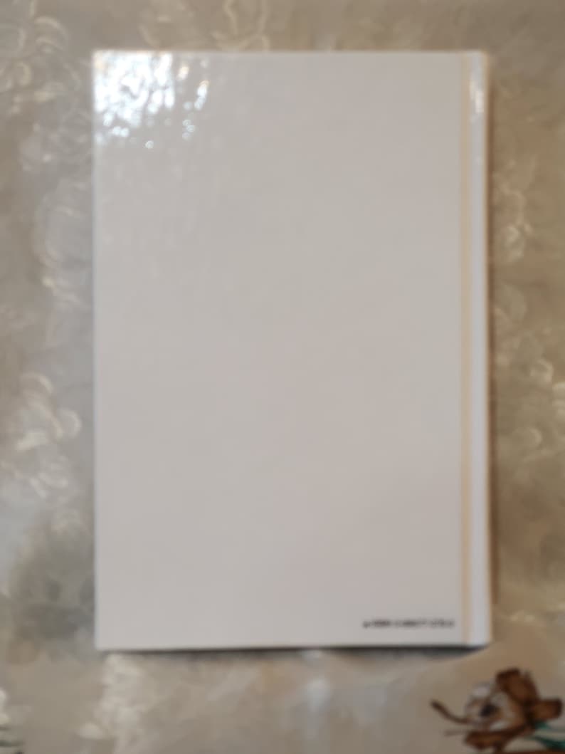 May include: White blank book cover with a glossy finish.