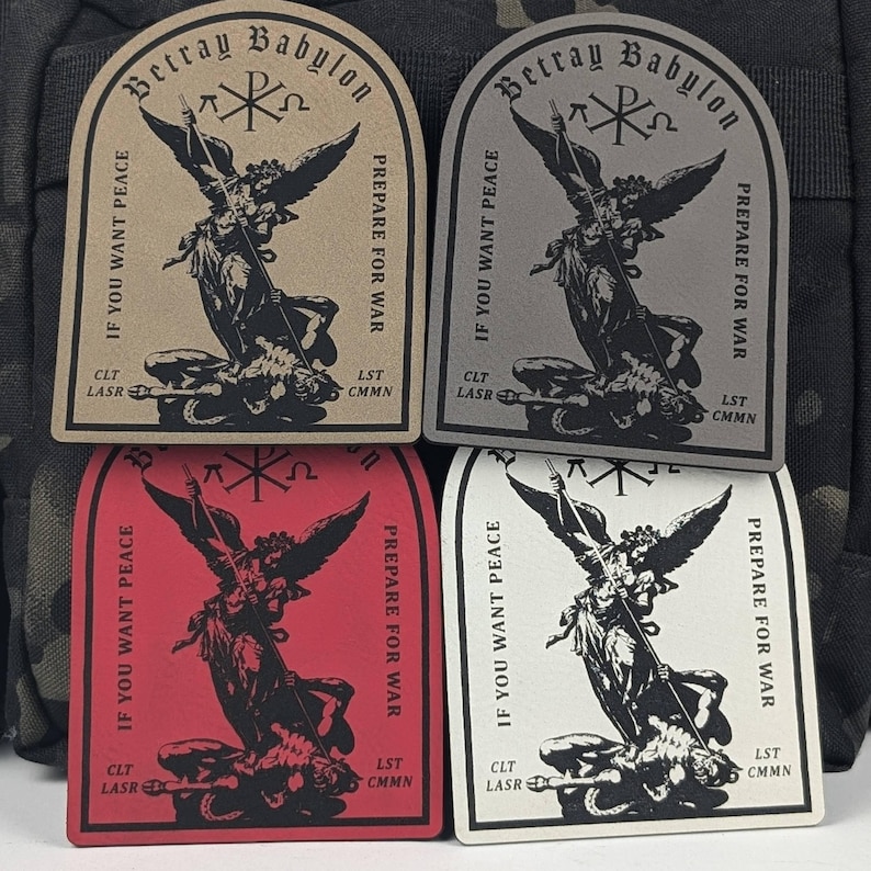 May include: Four embroidered patches with a black and white image of an angel trampling a demon. The patches are beige, gray, red, and white. The text on the patches reads "Betray Babylon", "If you want peace, prepare for war", "CLT LASR", and "LST CMMN".