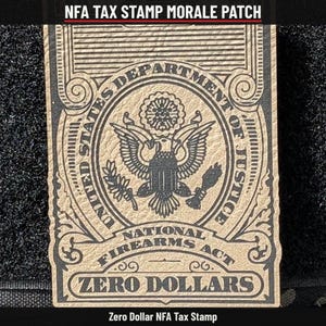 May include: A rectangular morale patch featuring a tan background with black text and graphics. It displays the text NFA TAX STAMP MORALE PATCH, UNITED STATES DEPARTMENT OF JUSTICE, NATIONAL FIREARMS ACT, and ZERO DOLLARS with an eagle emblem.