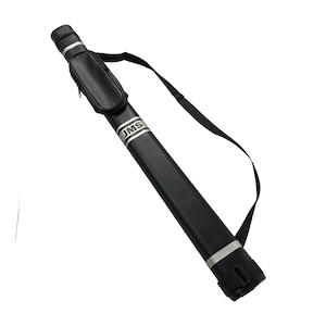 May include: Black cylindrical carrying case with a shoulder strap. The case has a small zippered pouch and silver bands. The text "JMS" is printed on the side. The case is designed to hold a long, slender object, such as a fishing rod or a pool cue.