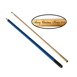 May include: Two pool cues, one with a blue shaft and black tip, and the other with a natural wood shaft and a white tip. The wood cue has the text "Merry Christmas Honey 2013" engraved on it.