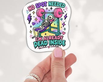 May include: A die-cut sticker featuring a skeleton lifting a pink barbell on a weight bench. The background is a pastel rainbow gradient with purple lightning bolts, stars, and hearts. Text reads: NO SPOT NEEDED I'M ALREADY DEAD INSIDE.