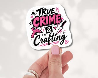 May include: A white die-cut sticker featuring the black and pink text True Crime & Crafting. The design includes a pink hot glue gun, a silver knife, small stars, and heart icons, all arranged on a white background with a glossy finish.