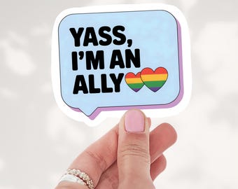 May include: A light blue speech bubble sticker with the black text YASS, I'M AN ALLY and two small rainbow-colored hearts. The sticker has a white border and a purple shadow effect, featuring a bold, clear design for display.