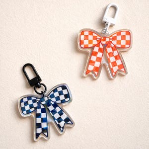 F1 Schlüsselanhänger Karierte Schleife | Süßer Formel 1 Schlüsselanhänger | McLaren Lando Norris Oscar Piastri Fan Geschenk | Ästhetischer Taschenanhänger