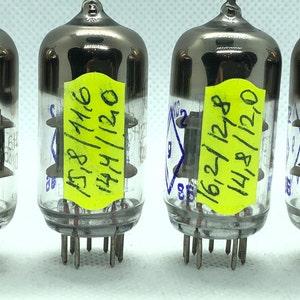 May include: Three vintage glass vacuum tubes with silver caps and yellow labels. The labels have handwritten numbers and dates, including "158/1/16" and "162/1/28".
