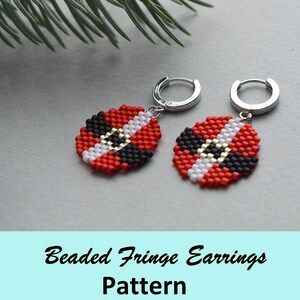May include: A pair of beaded fringe earrings with a red, white, and black geometric pattern. The earrings are attached to silver hoops.