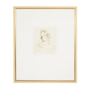 May include: A framed line drawing on paper featuring a profile portrait of a person with curly hair, shown from the chest up with hands clasped. The artwork is set within a wide white mat and a thin, metallic gold-toned rectangular frame.