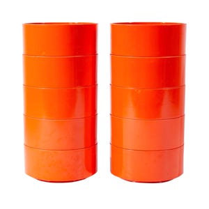 May include: Two stacks of six bright orange cylindrical containers are displayed against a white background. The containers are evenly stacked, with a consistent diameter and height. The smooth, glossy surface reflects light, highlighting their vibrant colour.