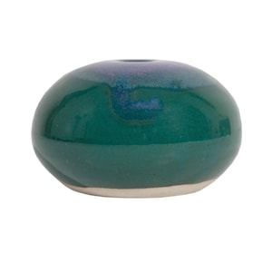 May include: A green ceramic vase with a rounded shape and a small opening at the top. The vase has a glossy finish and a subtle iridescent sheen.