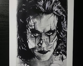May include: Black and white drawing of a man with long, dark hair. He has a serious expression on his face and is wearing dark makeup around his eyes. The drawing is done in a realistic style.