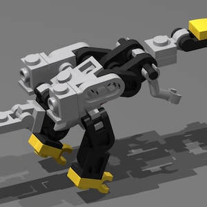 May include: A small, black, gray, and yellow Lego model of a dinosaur. The dinosaur is standing on a gray surface.