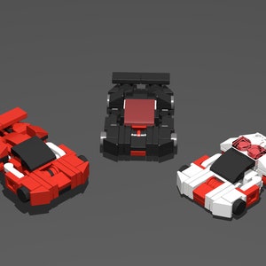 Könnte beinhalten: Drei Miniatur-Lego-Rennwagen in Rot, Schwarz und Weiß. Die Autos haben schwarze Windschutzscheiben und rote Akzente.