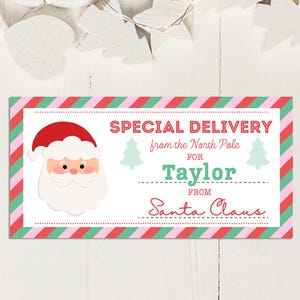 May include: A rectangular gift tag with a red and green striped border and the words "Special Delivery from the North Pole" printed in red and green. The tag features a Santa Claus illustration and the name "Taylor".
