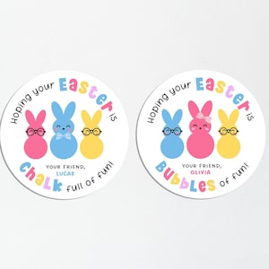 May include: Two round stickers with a white background and colorful Easter bunny illustrations. The stickers say "Hoping your Easter is Chalk full of fun!" and "Hoping your Easter is Bubbles of fun!" with the names Lucas and Olivia.