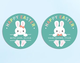 May include: Two round, turquoise blue stickers with white bunny rabbits peeking over the top. The stickers say "Happy Easter" in rainbow letters. One sticker says "With love, Olivia" and the other says "Your friend, Tyler".
