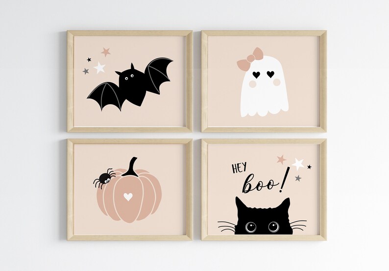 May include: Four framed prints with a pink background and black and white illustrations. The prints feature a bat, a ghost, a pumpkin with a spider, and a black cat with the text "Hey Boo!"