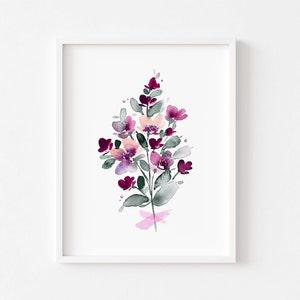 May include: A watercolour painting of a bouquet of pink and purple flowers with green leaves. The flowers are arranged in a loose, organic style, and the painting has a soft, romantic feel.