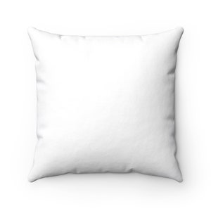 May include: A plain white throw pillow with a square shape and a soft, smooth texture.