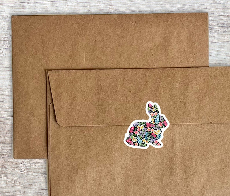 May include: A brown paper envelope with a floral patterned rabbit sticker on the front.