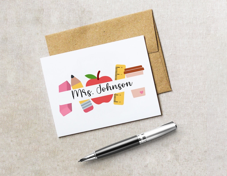 May include: A white card with a red apple, yellow ruler, pink eraser, and a pencil. The text "Mrs. Johnson" is written on a white banner.