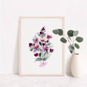 May include: A watercolour painting of a bouquet of pink and purple flowers with green leaves. The flowers are painted in a loose, abstract style.