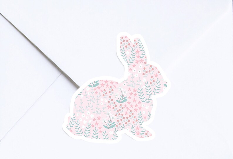 May include: A pink and green floral patterned bunny sticker. The bunny is facing the right side of the image.