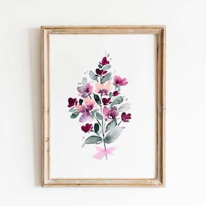 May include: A framed watercolour painting of a bouquet of pink and purple flowers with green leaves. The flowers are painted in a loose, abstract style.