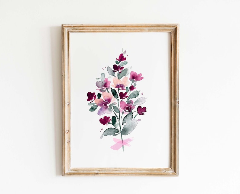 May include: A framed watercolour painting of a bouquet of pink and purple flowers with green leaves. The flowers are painted in a loose, abstract style.