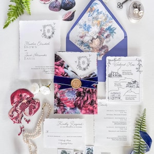 May include: Elegant wedding invitation suite with floral and botanical elements. Includes invitation cards, RSVP cards, a weekend map, and details card. Features a floral envelope liner, a navy blue ribbon, and a wax seal.