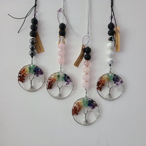 May include: Four silver wire tree of life charms with rainbow coloured gemstones, each with a different coloured stone and lava bead string.
