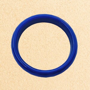 May include: A bright blue silicone ring, perfect for stacking or wearing alone.