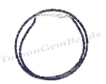 May include: A double strand necklace made with small, faceted, dark purple amethyst beads. The necklace has a silver clasp.