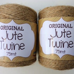 May include: Two spools of natural brown jute twine, each labeled "ORIGINAL Jute Twine 75mt".