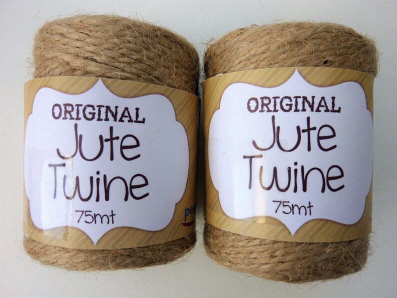 May include: Two spools of natural brown jute twine, each labeled "ORIGINAL Jute Twine 75mt".