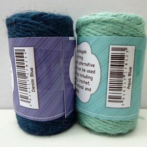 May include: Two spools of twine, one denim blue and one aqua blue. The spools have barcodes and labels that say "Denim Blue" and "Aqua Blue".