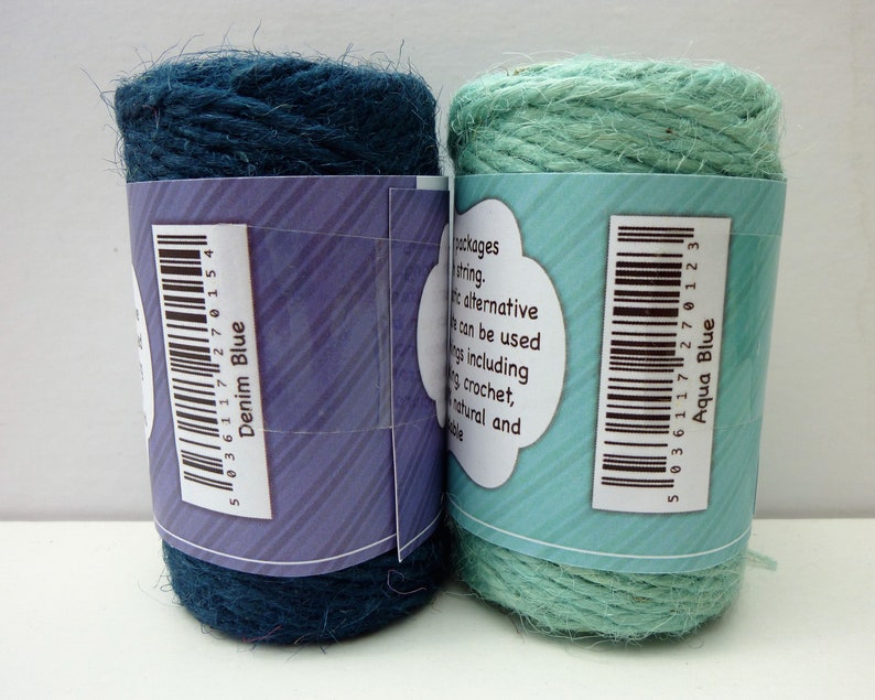 May include: Two spools of twine, one denim blue and one aqua blue. The spools have barcodes and labels that say "Denim Blue" and "Aqua Blue".