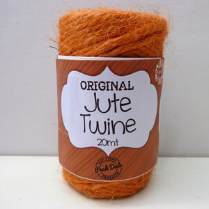 May include: A roll of orange jute twine with a label that reads "ORIGINAL Jute Twine 20mt" and "Peak Dale Products".