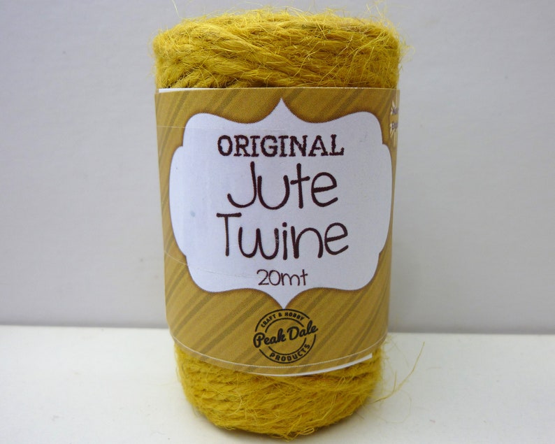 May include: A roll of yellow jute twine labeled "ORIGINAL Jute Twine 20mt" with a Peak Dale Products logo.