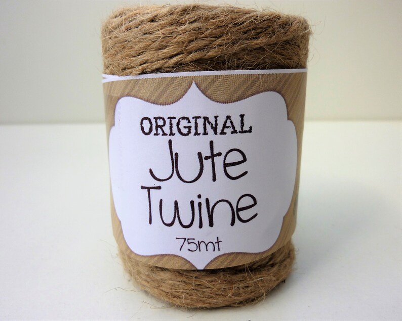 May include: A roll of natural brown jute twine with a white label that reads "ORIGINAL Jute Twine 75mt".