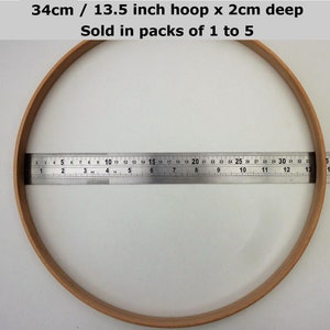 May include: A 13.5 inch diameter wooden embroidery hoop with a 2 inch depth. The hoop is measured with a ruler.  34cm / 13.5 inch hoop x 2cm deep Sold in packs of 1 to 5