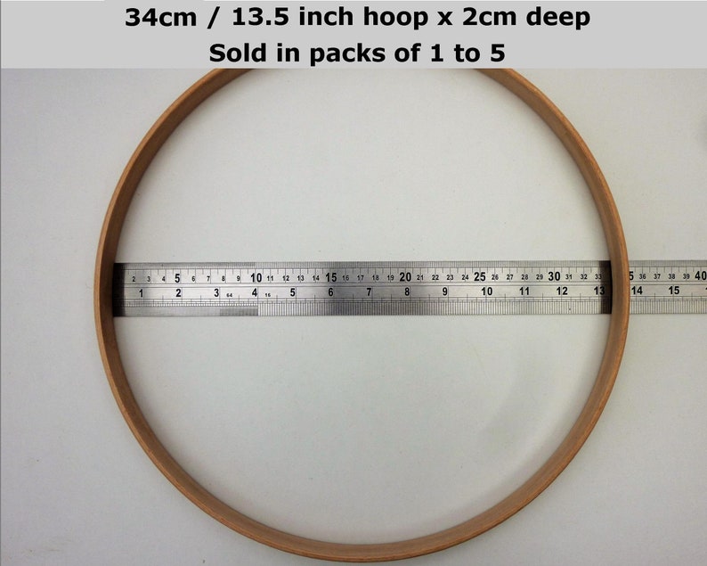 May include: A 13.5 inch diameter wooden embroidery hoop with a 2 inch depth. The hoop is measured with a ruler.  34cm / 13.5 inch hoop x 2cm deep Sold in packs of 1 to 5