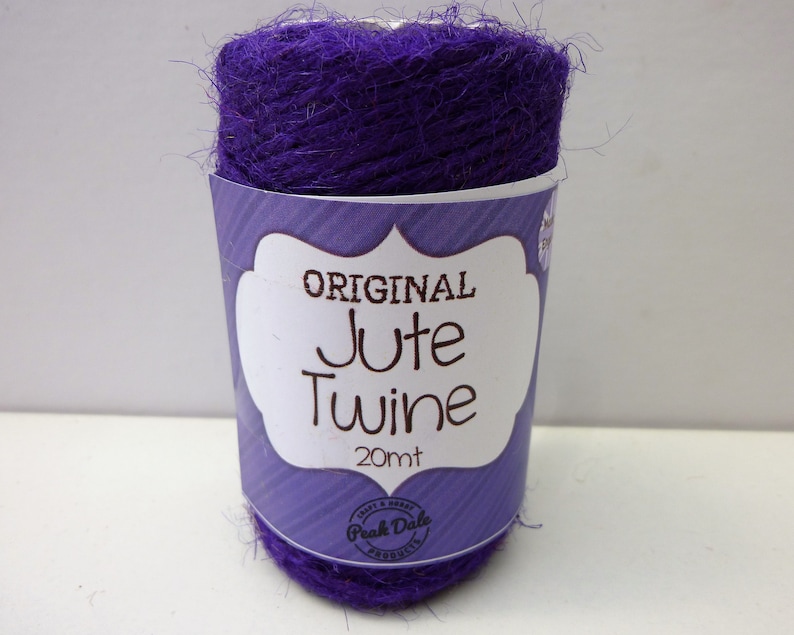 May include: A roll of purple jute twine labeled "ORIGINAL Jute Twine 20mt" with a Peak Dale Products logo.