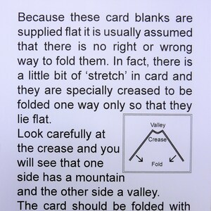 May include: A diagram showing how to fold cards correctly. The diagram shows a crease with a mountain on one side and a valley on the other. The text says "Valley Crease Fold" and explains that the card should be folded with the valley on the outside.