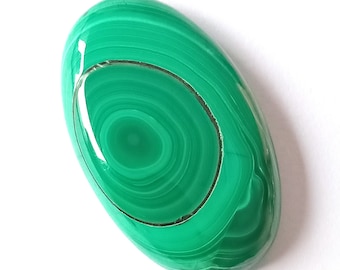 May include: A smooth, oval-shaped malachite stone with a swirling green pattern. The stone has a polished finish and a light green color.