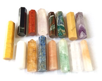 May include: A set of 16 hexagonal crystal wands in various colors, including yellow, white, red, pink, green, blue, and purple. The wands are arranged in two rows of eight.