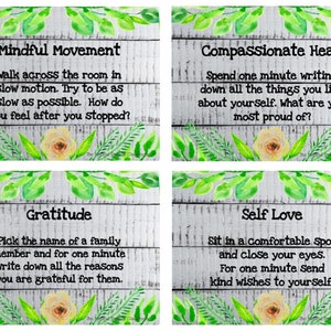 May include: Four white wooden cards with green leaves and yellow flowers. Each card has a different self-care activity: Mindful Movement, Compassionate Heart, Gratitude, and Self Love. The text on each card describes the activity.