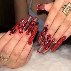Loving these nails. #nails #acrylic #red #rhinestones